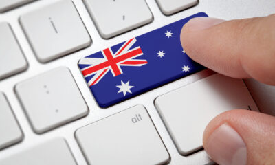 Computer key with the Australia on it. Male hand pressing computer key with Australia flag.